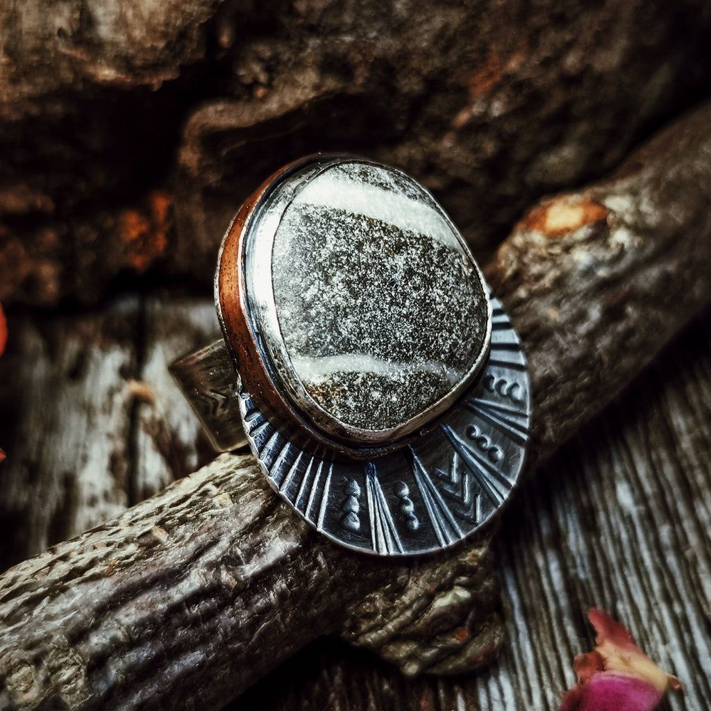 Photograph of Ring I from the Maven Flux Sticks & Stones Collection including detail in the engraving and setting. Beautifully crafted from nature.