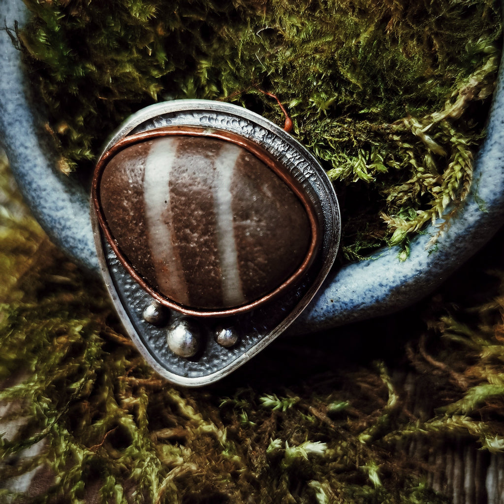 Photograph of Ring V from the Maven Flux Sticks & Stones Collection including detail in the engraving and setting. Beautifully crafted from nature.